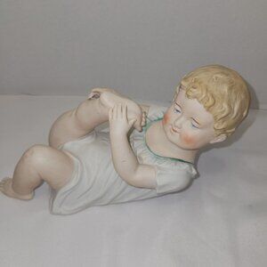 Vintage Andrea By Sadek Piano Baby Bisque Porcelain Boy Laying Down 7" H x 9.5"